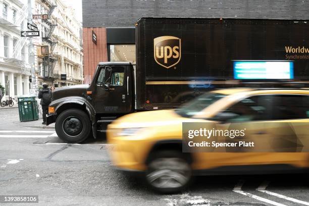 United Parcel Service truck delivers boxes in Manhattan on April 26, 2022 in New York City. The Atlanta-based courier announced that revenue rose...