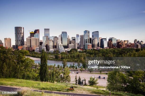 calgary downtown,panoramic view of buildings in city against clear sky,calgary,alberta,canada - calgary stock-fotos und bilder