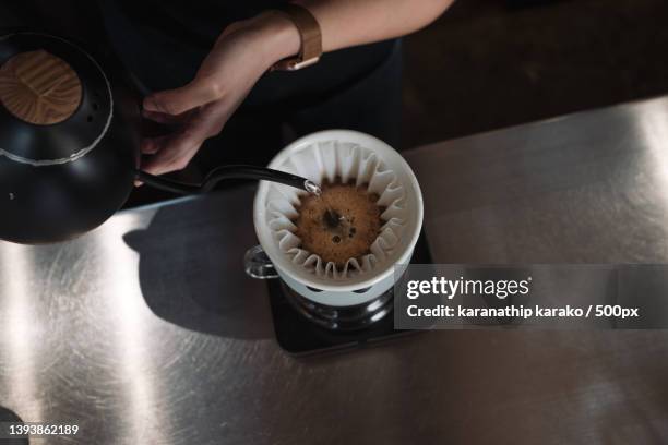 barista dripping coffee and slow coffee bar style - grinder stock-fotos und bilder