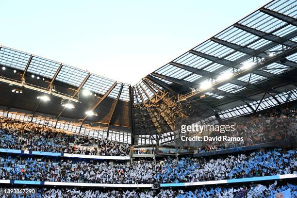 Manchester City fans wave flags inside the stadium prior to the UEFA Champions League Semi Final Leg One match between Manchester City and Real...