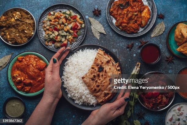 assorted indian ethnic food buffet on rustic concrete table from above - nepal road stock pictures, royalty-free photos & images