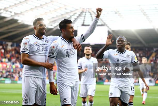 Joel Piroe of Swansea City celebrates with team mate Cyrus Christie after scoring their sides second goal during the Sky Bet Championship match...