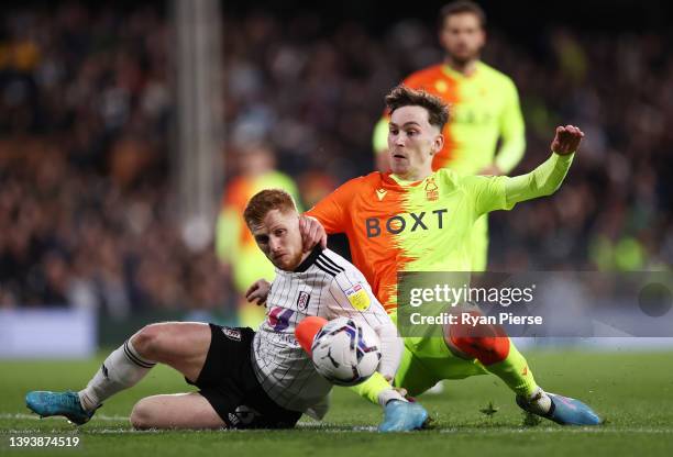 Harrison Reed of Fulham is challenged by James Garner of Nottingham Forest during the Sky Bet Championship match between Fulham and Nottingham Forest...