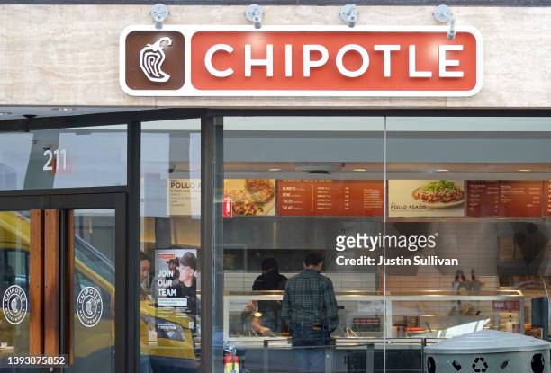 Customer orders food at a Chipotle restaurant on April 26, 2022 in San Francisco, California. Chipotle Mexican Grill will report its first quarter...