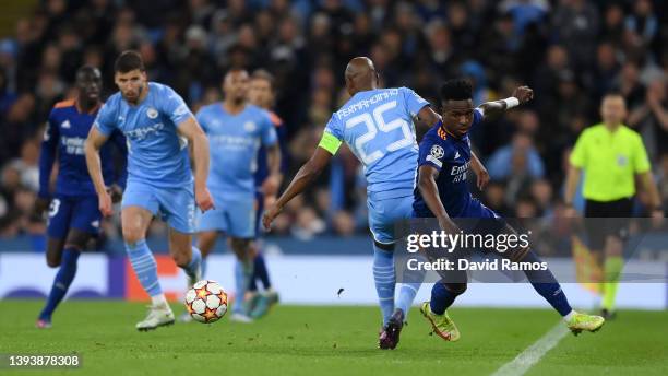 Vinicius Junior of Real Madrid runs ahead of Fernandinho of Manchester City leading to a goal during the UEFA Champions League Semi Final Leg One...