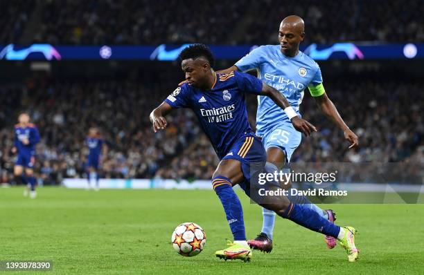 Vinicius Junior of Real Madrid runs ahead of Fernandinho of Manchester City leading to a goal during the UEFA Champions League Semi Final Leg One...