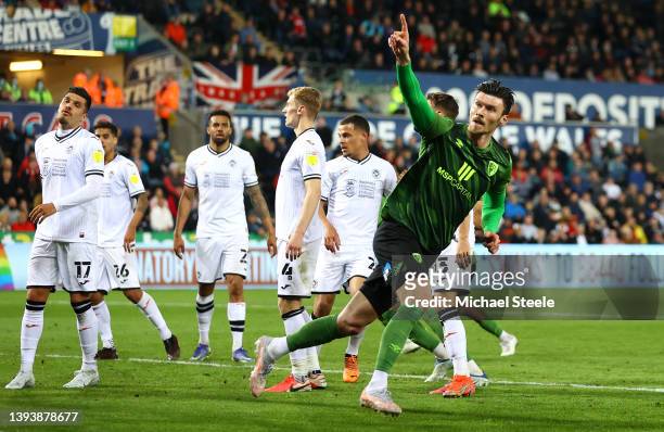 Kieffer Moore of AFC Bournemouth celebrates after scoring their sides first goal during the Sky Bet Championship match between Swansea City and AFC...