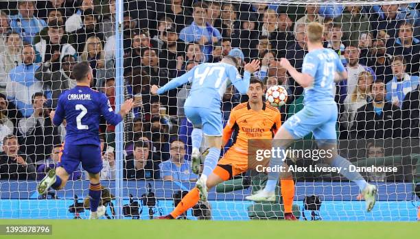 Phil Foden of Manchester City scores their third goal past Thibaut Courtois of Real Madrid during the UEFA Champions League Semi Final Leg One match...