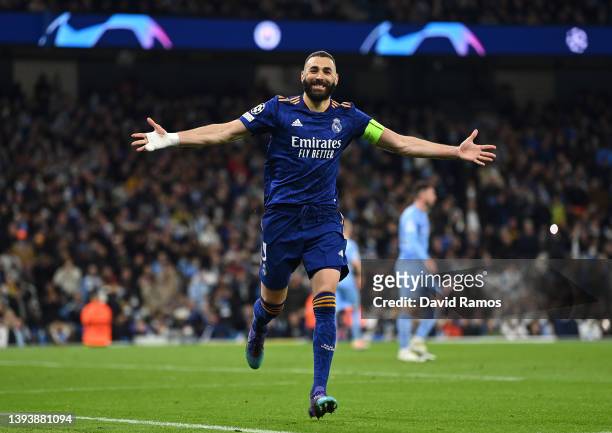 Karim Benzema of Real Madrid celebrates after scoring their side's third goal from the penalty spot during the UEFA Champions League Semi Final Leg...