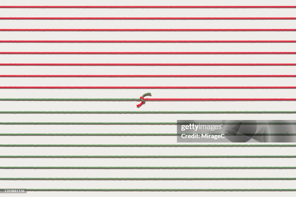 Red and Green Colored Straightened Ropes Tied and Connected Together