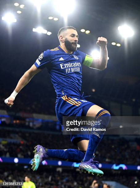 Karim Benzema of Real Madrid celebrates after scoring their side's third goal from the penalty spot during the UEFA Champions League Semi Final Leg...