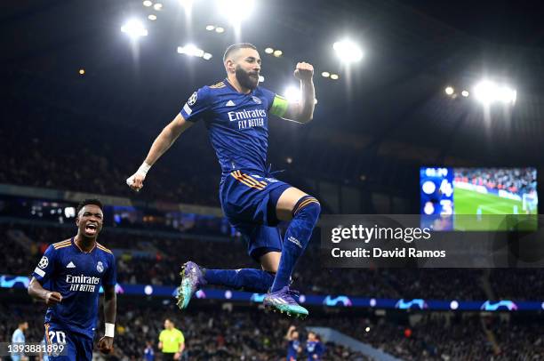 Karim Benzema of Real Madrid celebrates after scoring their side's third goal from the penalty spot during the UEFA Champions League Semi Final Leg...