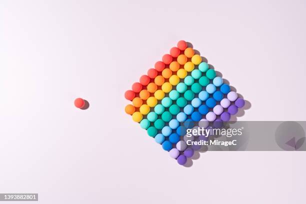an isolated red sphere stay away from the group - closing gap stock pictures, royalty-free photos & images