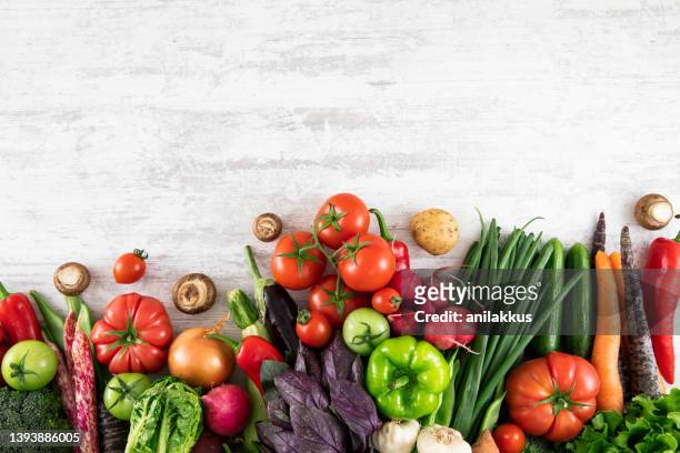 fresh vegetables on white wooden table - vegetables white background stock pictures, royalty-free photos & images