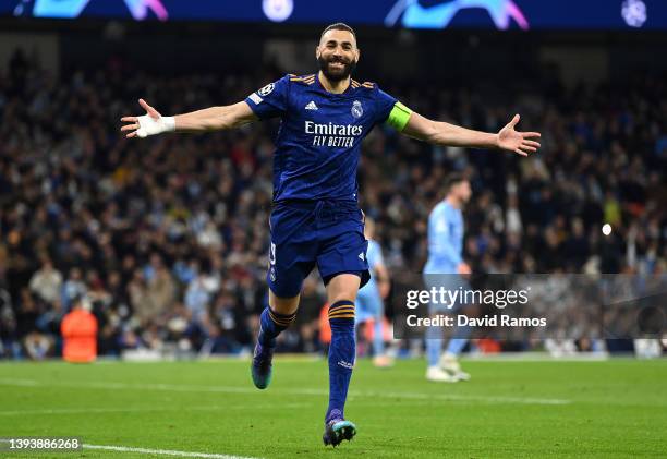 Karim Benzema of Real Madrid celebrates after scoring their side's third goal from the penalty spot during the UEFA Champions League Semi Final Leg...