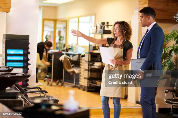sales visit to the salon - business man haircut stock pictures, royalty-free photos & images