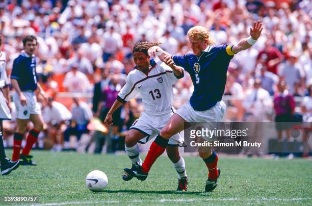 Cobi Jones of USA and Colin Henry of Scotland in action during the match between Scotland and USA at RFK stadium on May 30 1998 in Washington DC.,...