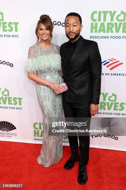 Chrissy Teigen and John Legend attends the City Harvest Presents The 2022 Gala: Red Supper Club at Cipriani 42nd Street on April 26, 2022 in New York...