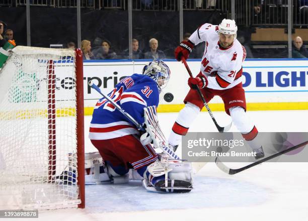 Igor Shesterkin of the New York Rangers makes the first period save on Nino Niederreiter of the Carolina Hurricanes at Madison Square Garden on April...