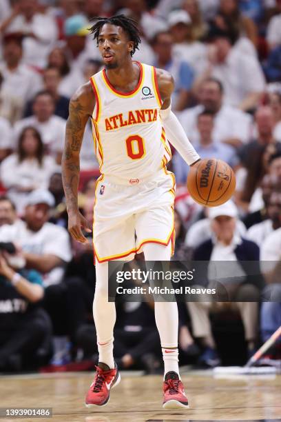 Delon Wright of the Atlanta Hawks dribbles up the court against the Miami Heat during the first half in Game Five of the Eastern Conference First...