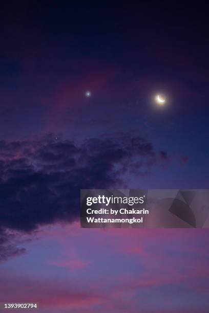 the crescent moon and conjuction of the great planets of our solar system - jupiter and venus. (apr 26, 2022) - chanthaburi sea bildbanksfoton och bilder