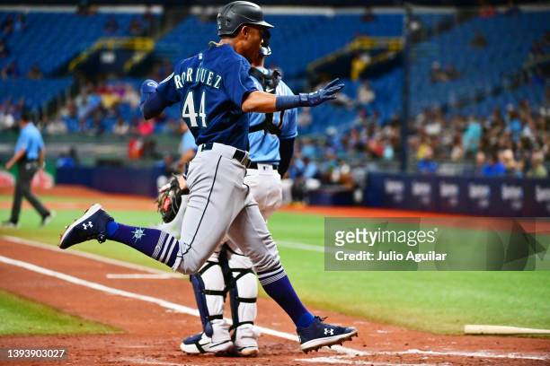 Julio Rodriguez of the Seattle Mariners scores in the fourth inning against the Tampa Bay Rays at Tropicana Field on April 26, 2022 in St Petersburg,...