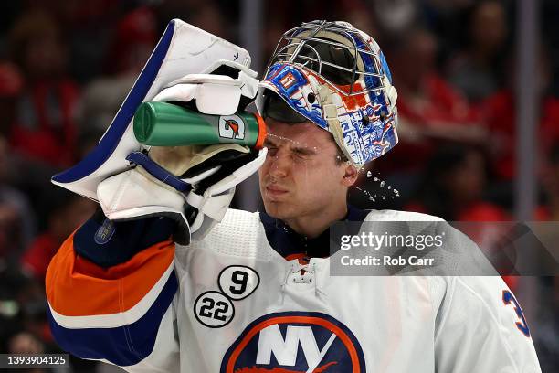 Goalie Ilya Sorokin of the New York Islanders gets a drink in the second period against the Washington Capitals at Capital One Arena on April 26,...