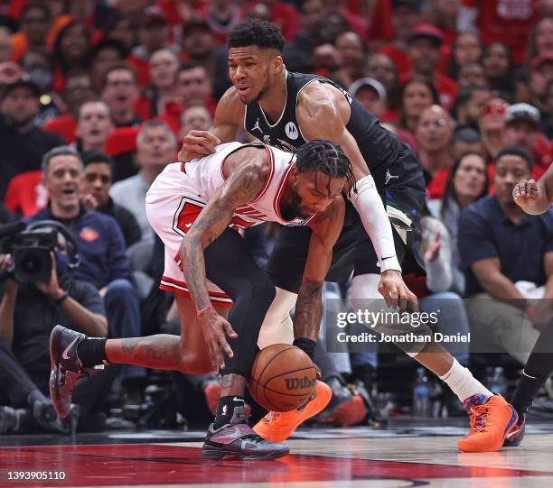 Derrick Jones Jr. #5 of the Chicago Bulls knocks the ball away for a steal against Giannis Antetokounmpo of the Milwaukee Bucks during Game Four of...