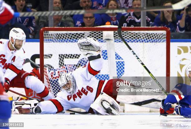 Pyotr Kochetkov of the Carolina Hurricanes makes the save late in the third period against the New York Rangers at Madison Square Garden on April 26,...