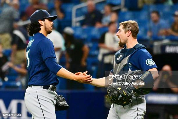 Andres Munoz and Tom Murphy of the Seattle Mariners celebrate after defeating the Tampa Bay Rays 8-4 at Tropicana Field on April 26, 2022 in St...