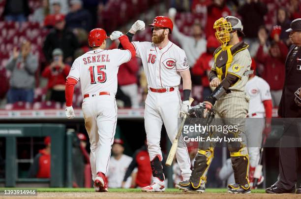 Nick Senzel celebrates with Colin Moran of the Cincinnati Reds after hitting a home run against the San Diego Padres at Great American Ball Park on...