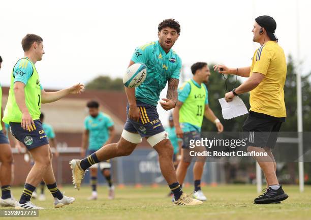 Te Kamaka Howden passes the ball during a Hurricanes Super Rugby training session at Powerhouse Junior Rugby Union Club on April 27, 2022 in...