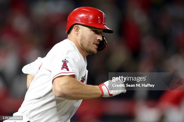 Mike Trout of the Los Angeles Angels runs to first base after connecting for an RBI double during the fifth inning of a game against the Cleveland...