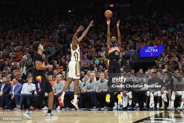 Mikal Bridges of the Phoenix Suns puts up a three-point shot over Herbert Jones of the New Orleans Pelicans during the first half of Game Five of the...