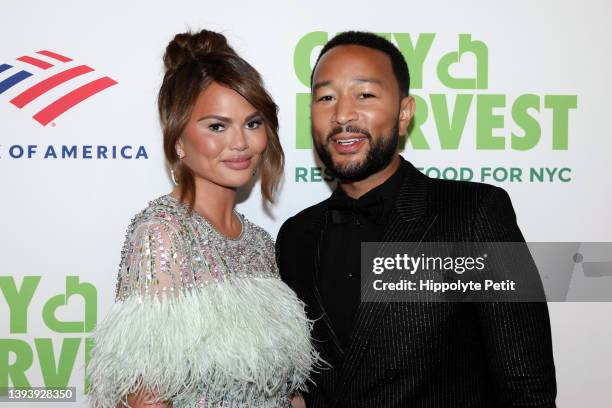 Chrissy Teigen and John Legend attend the 2022 City Harvest "Red Supper Club" Fundraising Gala at Cipriani 42nd Street on April 26, 2022 in New York...
