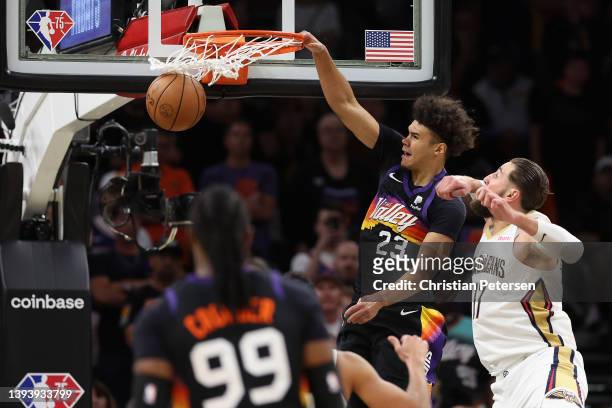Cameron Johnson of the Phoenix Suns slam dunks the ball past Jonas Valanciunas of the New Orleans Pelicans during the second half of Game Five of the...