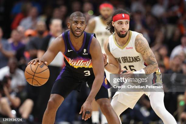 Chris Paul of the Phoenix Suns handles the ball against Jose Alvarado of the New Orleans Pelicans during the second half of Game Five of the Western...