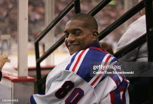 Kevin Weekes of the New York Rangers looks from his spot in the corner of the arena as a backup goalie during their NHL game against the Pittsburgh...
