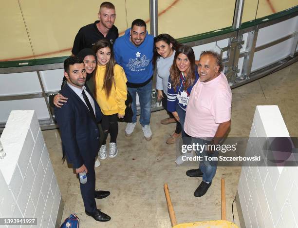 Nazem Kadri of the Toronto Maple Leafs poses with his father and family members after their NHL preseason game against the Ottawa Senators on...