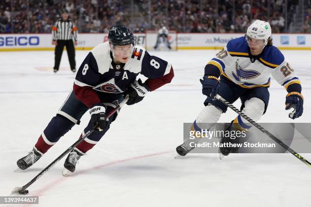 Cale Makar of the Colorado Avalanche advances the puck against Brandon Saad of the St Louis Blues in the second period at Ball Arena on April 26,...
