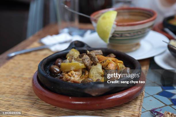 moroccan tagine in grey ceramic clay dish series - tajine fotografías e imágenes de stock