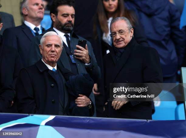 Florentino Perez president of Real Madrid and secretary Enrique Sanchez Gonzalez take their seats ahead of the UEFA Champions League Semi Final Leg...