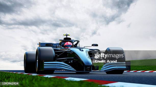 black race car driving on a race track - race 1 imagens e fotografias de stock