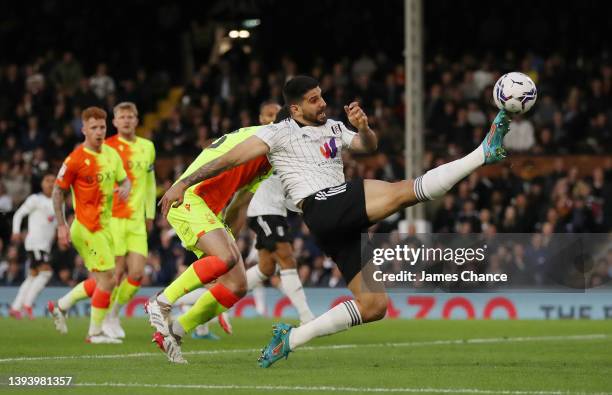 Aleksandar Mitrovic of Fulham stretches to reach the ball during the Sky Bet Championship match between Fulham and Nottingham Forest at Craven...