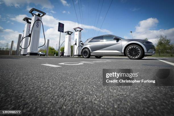 Hyundai Ioniq battery electric vehicle charges at an Ionity GmbH electric car charging station at Skelton Lake motorway service area on April 26,...