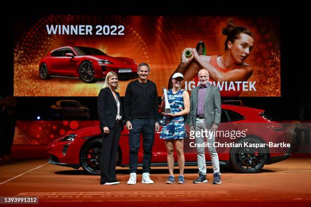 Anke Huber, Oliver Blume, CEO of Porsche, Iga Swiatek and Markus Guenthardt, director of tournament, pose for a photo after women`s final match...