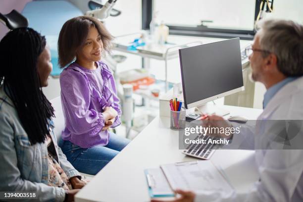 consultations with doctors and teen patients before receiving the hpv vaccine - hpv vaccine stock pictures, royalty-free photos & images