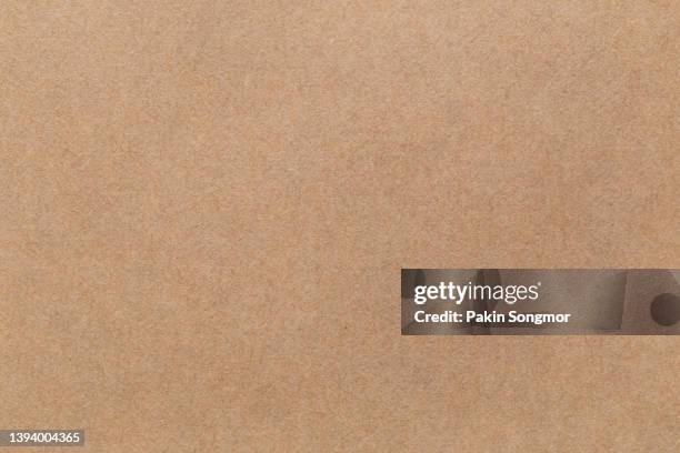 brown color eco recycled kraft paper sheet texture cardboard background. - striped suit stock-fotos und bilder