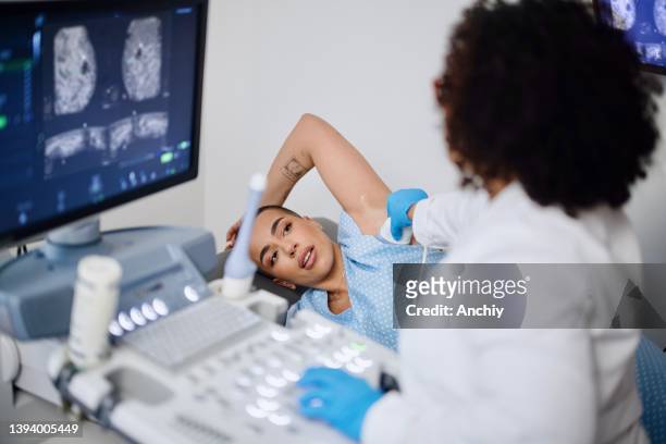 breast ultrasound exam - diagnostic aid stock pictures, royalty-free photos & images