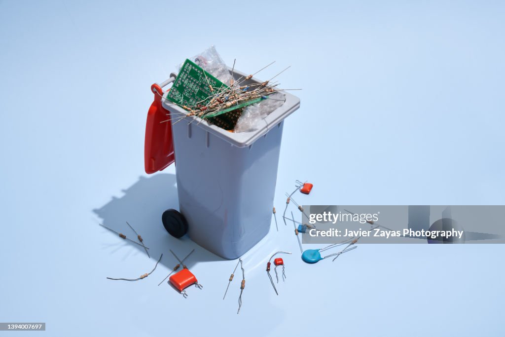 Electronic Waste Container Example Electronic Waste Inside A Waste Container On Blue Background High-Res ...